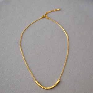 Minimalist gold plated brass necklace with faceted square beads on delicate chain