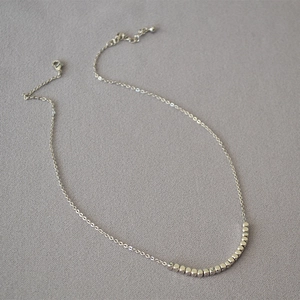 Minimalist silver-plated brass necklace with polished square beads and adjustable chain