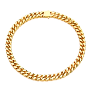 Polished gold Cuban link chain with secure box clasp on white background