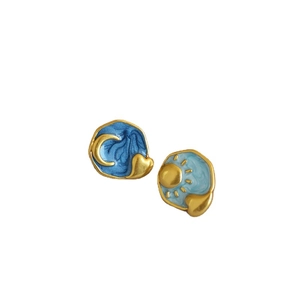 Asymmetric sun and moon enamel stud earrings in gold finish with blue heart accents