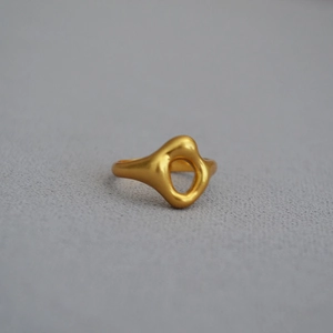 Modern irregular hollow gold-plated brass ring with matte finish and organic flowing design
