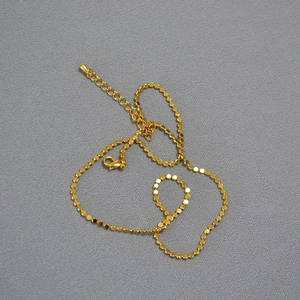 Elegant gold plated brass choker featuring delicate sequin discs and lobster clasp closure