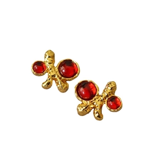 Vintage gold textured irregular earrings with ruby red stones in baroque palace style