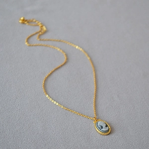 French vintage necklace with golden cameo relief pendant and small rice pearls
