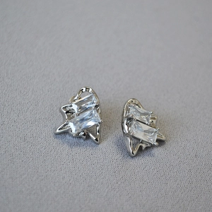 Minimalist silver-tone stud earrings with rectangular cubic zirconia in fluid metal frames