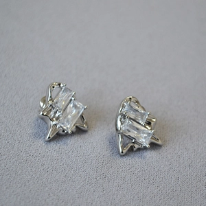 Elegant silver earrings featuring rectangular zircon stones in organic fluid frames
