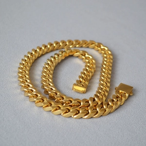 Detailed view of heavy-duty gold-plated Cuban chain link necklace with box clasp