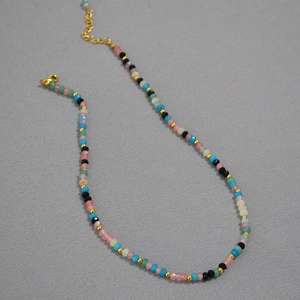 Detailed view of handmade colorful faceted beads necklace with gold lobster clasp
