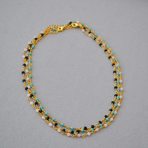 Three-layer French-style choker with black spinel beads and golden link chain detail