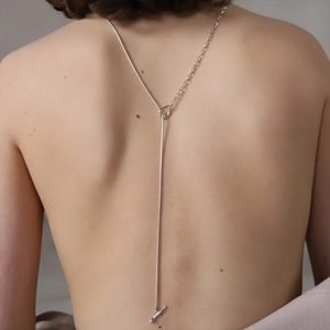 Silver Y-shaped back necklace with asymmetrical snake and O-ring chain design