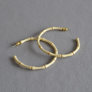 Chic bamboo-style cream enamel hoop earrings with gold-plated metal accents for women