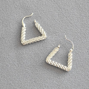 Textured geometric trapezoid sterling silver earrings with a shimmering star cluster finish