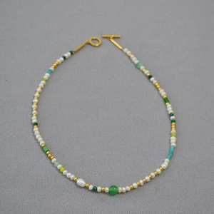 Minimalist freshwater pearl necklace with multi-colored beads and golden toggle clasp