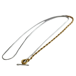 Two-tone mixed chain necklace featuring gold toggle clasp and silver snake chain style