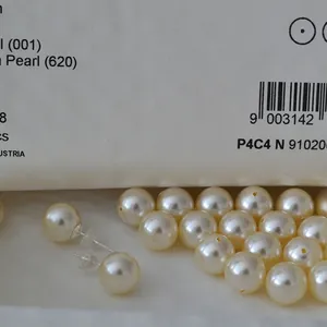 Detail shot of vintage 925 silver cream faux pearl earrings with smooth satin luster