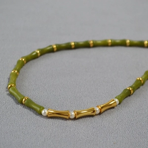 Bamboo style necklace with green jade beads, golden segments and white pearls