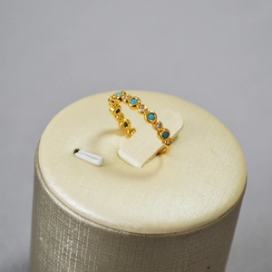 Elegant gold-plated brass ring with alternating turquoise and white zircon stones