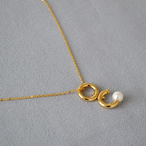 Collier à double anneau rotatif doré avec pendentif perle élégant pour femmes