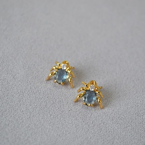Spider shaped stud earrings with blue gemstone and gold plated 925 silver needle