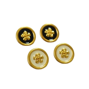 Retro gold plated enamel camellia stud earrings with black and cream white details
