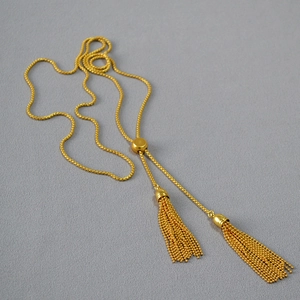 Minimalist gold tassel sweater necklace with adjustable slider bead and double fringe