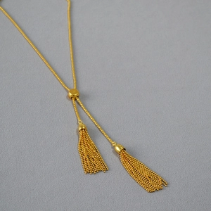 Minimalist gold tassel sweater necklace with adjustable slider bead and fine bead chains