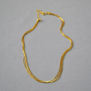 Minimalist multi-layered gold skinny chain necklace with adjustable lobster clasp closure