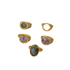 Vintage gold plated brass rings with natural gemstones in a multi-claw setting