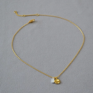 French retro style two-tone necklace with gold and silver geometric pendants