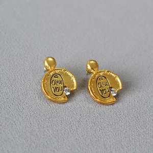 Irregular vintage gold studs with olive you engraving and sparkling zircon stone