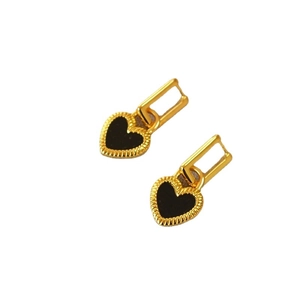 Minimalist brass gold-plated heart earrings with black agate inlays on white background