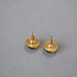 Back view of vintage ruby stud earrings with 925 silver needles and plastic safety backs