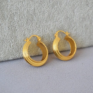 French retro striped gold hoop earrings with beaded edges and ribbed metal texture