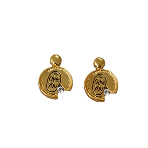 Vintage irregular golden earrings with olive you engraving and sparkling zircon