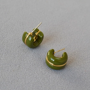Olive green chunky C-shaped hoop earrings with gold line accent shown at a 45-degree angle