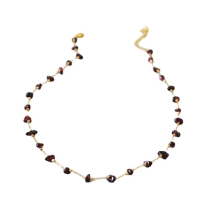 Minimalist gold necklace with irregular burgundy garnet stones on a fine handmade chain
