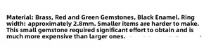 Detail showing 2.8mm brass ring band width with red green gems and black enamel finish