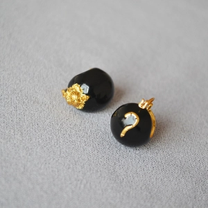 Retro black enamel earrings featuring golden tiger head relief and mystery symbol