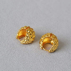 Golden textured hoop earrings with vintage diamond pattern and classic latch closure