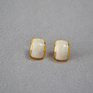 Vintage geometric gold plated brass earrings with white marble enamel and silver needles