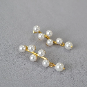 Elegant gold vine earrings with white pearls in a geometric tassel design for women