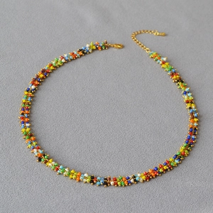 Detail of colorful handmade beaded necklace with golden adjustable lobster clasp