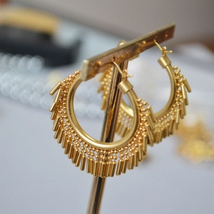 Vintage gold-plated brass hoop earrings with dynamic metal fringe and beaded texture
