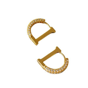 Gold D-shaped hoop earrings with micro-paved cubic zirconia for a luxury look
