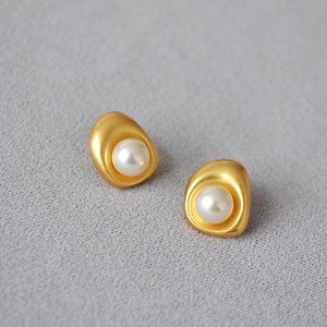 Baroque organic shaped gold brass stud earrings with centered white pearl inlay