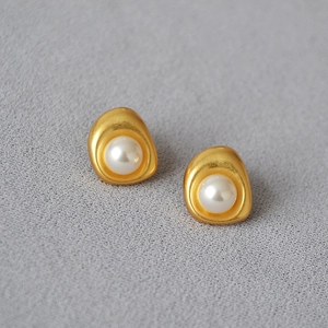 Baroque irregular brass gold plated earrings with white pearls in a minimalist design
