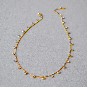 Elegant gold plated brass choker necklace with clear cubic zirconia crystal drops