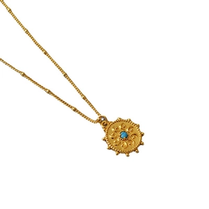 Collier vintage français avec pendentif soleil doré et perle de turquoise incrustée