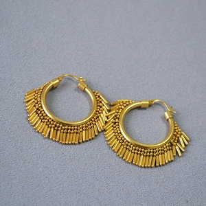 Vintage gold-plated brass hoop earrings with dynamic tassel fringe and metallic beads