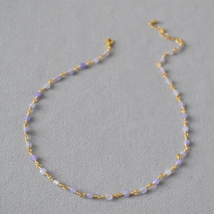 Elegant gold-plated brass necklace featuring purple stone beads and a lobster clasp